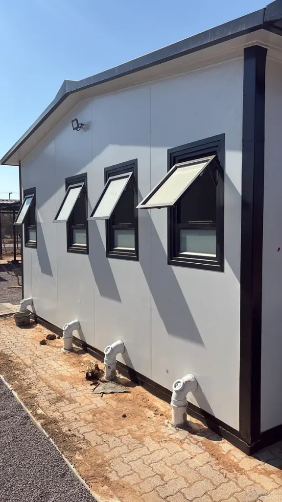 Prefab ablution block with top-hung windows